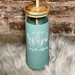 She Belongs Among The Wildflowers - 20 Ounce Engraved Glass Tumbler With Silicone Sleeve
